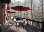 Back Deck has 2 patio Tables that seat 10 with 2 extra chairs. Both Umbrella`s have lights.Gas BBQ Grill